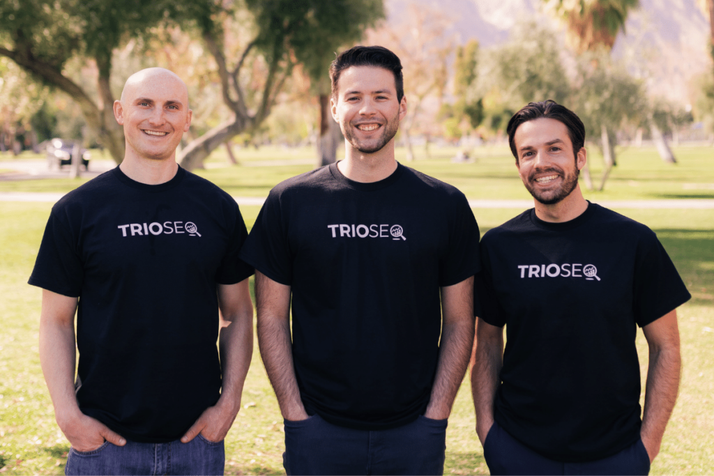 Team photo of Nathan, Steven, Connor in black TRIOS® shirts outdoors.