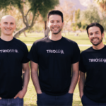 Team photo of Nathan, Steven, Connor in black TRIOS® shirts outdoors.