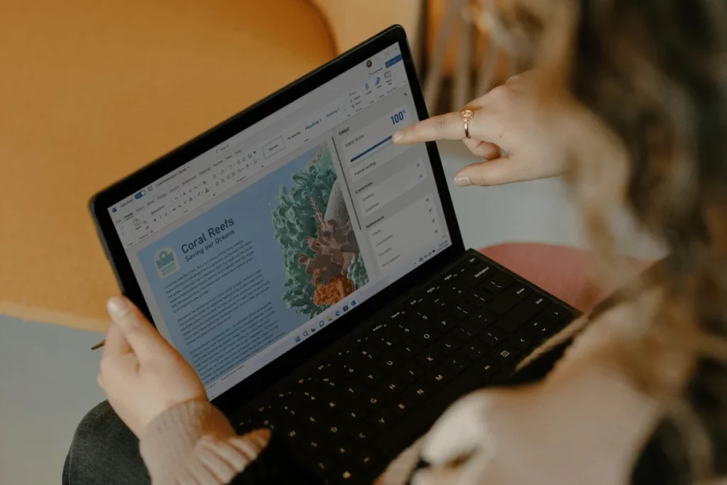 Person editing a document on a tablet with a touchscreen.